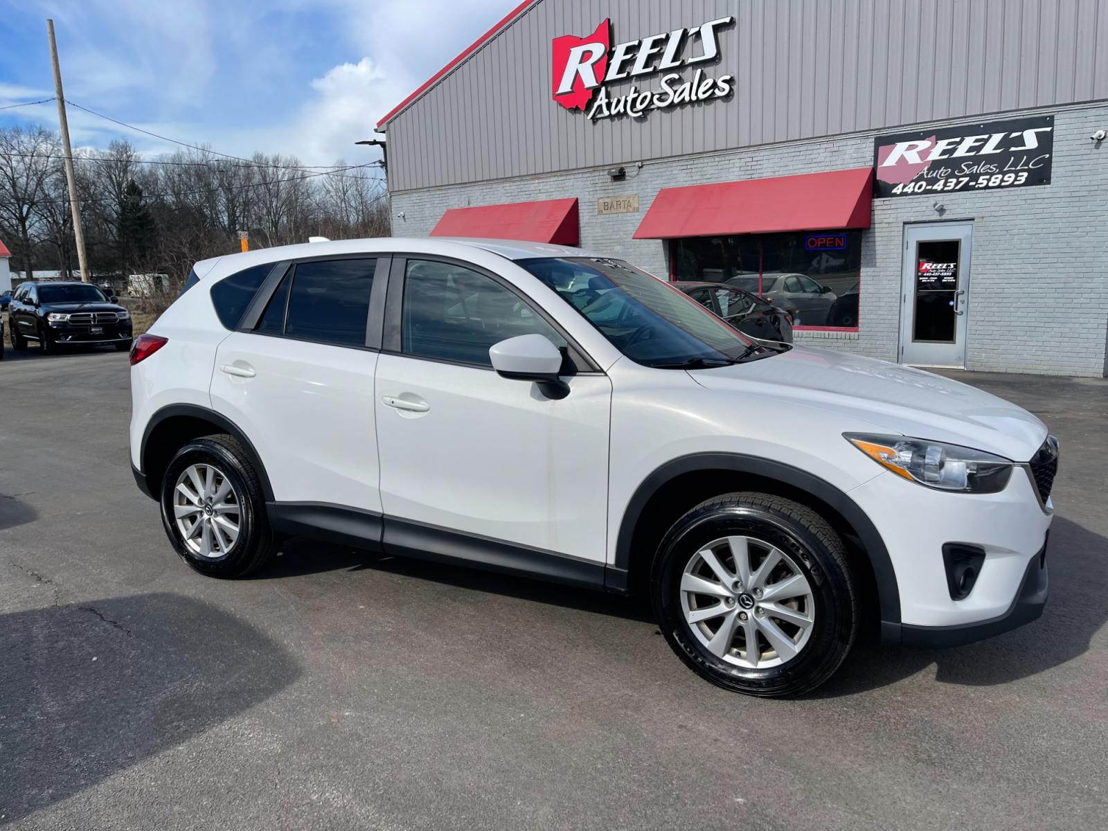 2015 White /Black Mazda CX-5 Touring AWD (JM3KE4CYXF0) with an 2.5L I4 DOHC 16V engine, 6-Speed Automatic transmission, located at 547 E. Main St., Orwell, OH, 44076, (440) 437-5893, 41.535435, -80.847855 - This 2015 Mazda CX-5 Touring AWD is a well-equipped SUV that offers a blend of performance, safety, and convenience for its drivers. Being a one-owner vehicle as per its Carfax report signifies well-attended maintenance and care. It is loaded with advanced features such as Blind Spot Monitoring and - Photo #3